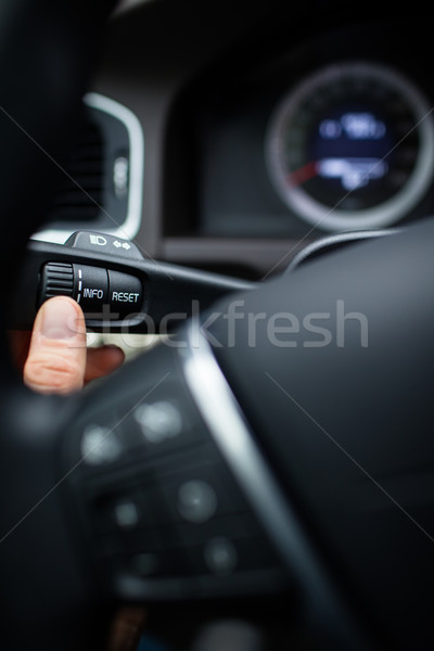 Modern car interior - driver pressing a button Stock photo © lightpoet