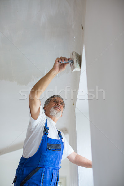 Senior painter man at work with a paint bucket Stock photo © lightpoet