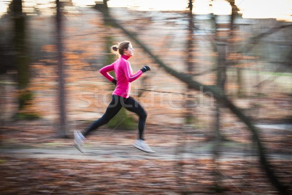 young woman running outdoors in a city park Stock photo © lightpoet