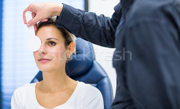 Optometry concept - pretty young woman having her eyes examined  Stock photo © lightpoet