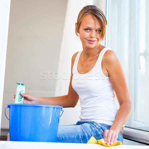 Pretty, young woman doing house work - washing windows Stock photo © lightpoet