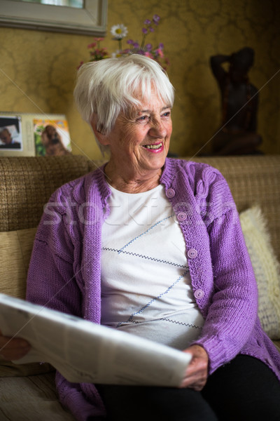 Senior woman reading morning newspape Stock photo © lightpoet