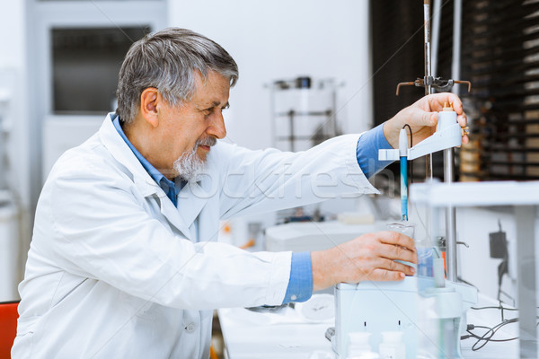 Senior male researcher carrying out scientific research in a lab Stock photo © lightpoet
