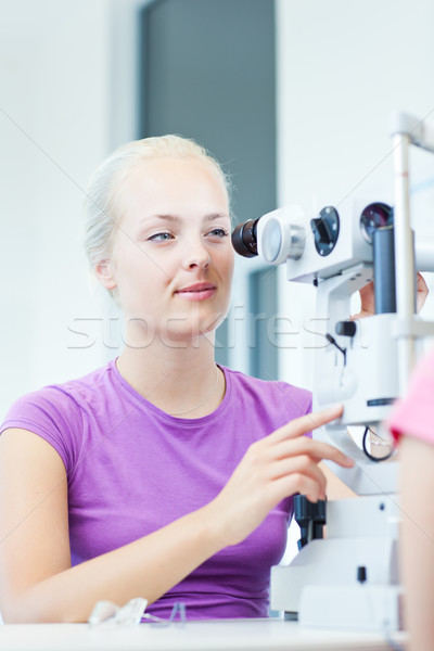 optometry concept - portrait of a young pretty optometrist using Stock photo © lightpoet