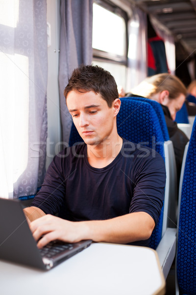 Foto stock: Bonito · moço · usando · laptop · computador · trem · raso