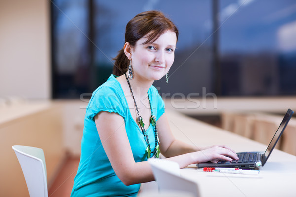 Pretty young female student with laptop on /university  campus Stock photo © lightpoet