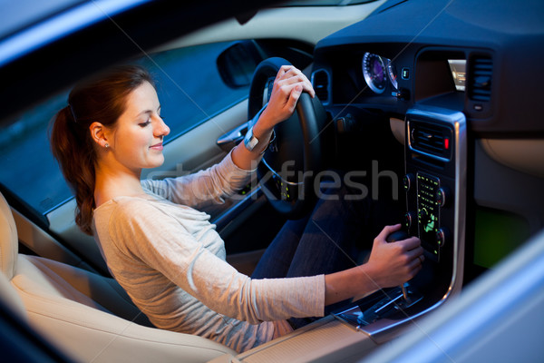 Csinos fiatal nő vezetés márka új autó sekély Stock fotó © lightpoet
