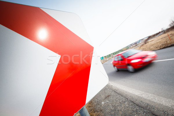 Stock photo: Traffic concept: car driving fast through a sharp turn 