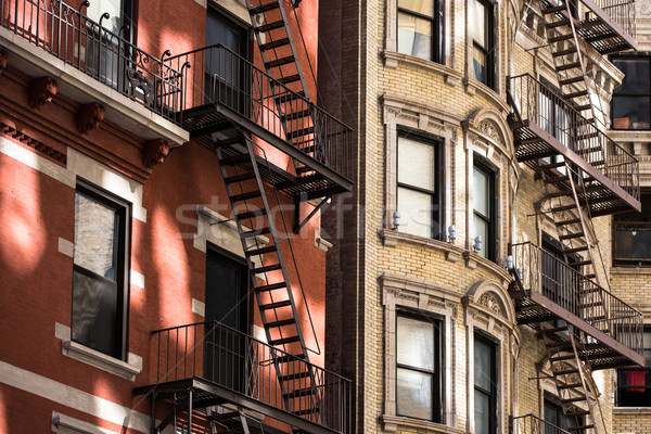 Old apartment building with fire escapes, Manhattan, New York Stock photo © lightpoet