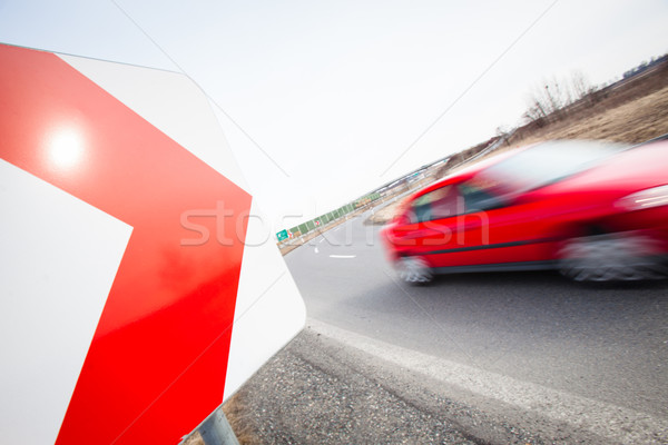 Traffic concept: car driving fast through a sharp turn  Stock photo © lightpoet