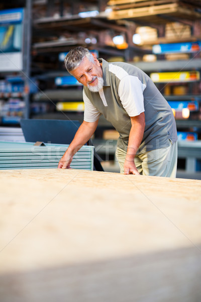 Stock photo: Man buying construction wood in a  DIY store