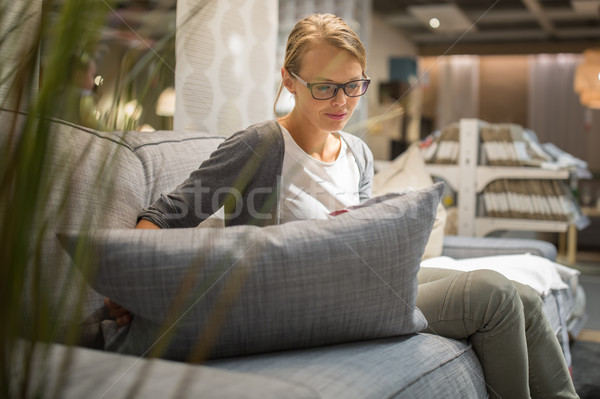 Pretty, young woman choosing the right furniture Stock photo © lightpoet