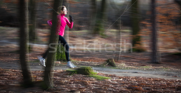 young woman running outdoors in a city park Stock photo © lightpoet