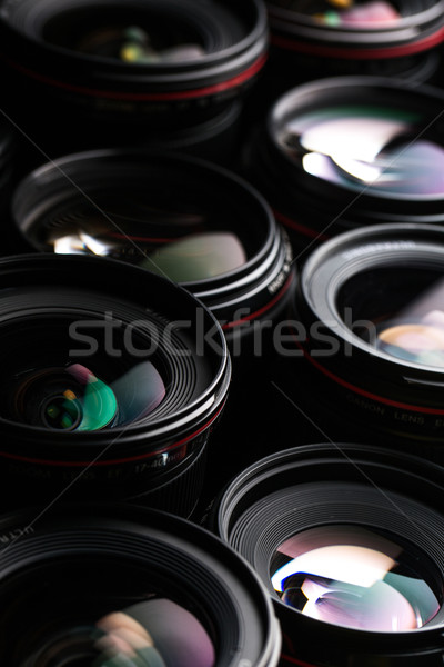 Modern camera lenses with reflections, low key image Stock photo © lightpoet