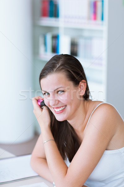 pretty female college student studying in the university library Stock photo © lightpoet