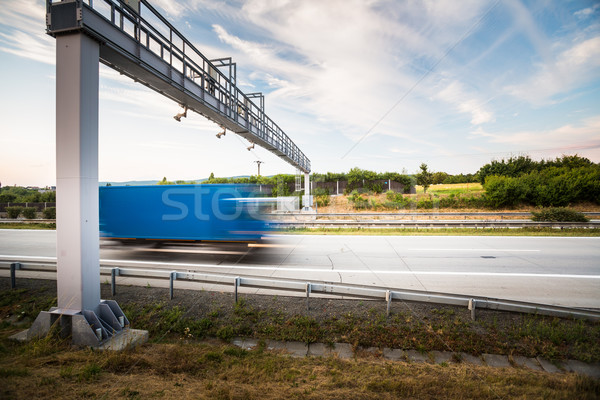 truck passing through a toll gate on a highway (motion blurred i Stock photo © lightpoet
