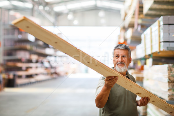 Man choosing and buying construction wood in a  DIY store Stock photo © lightpoet