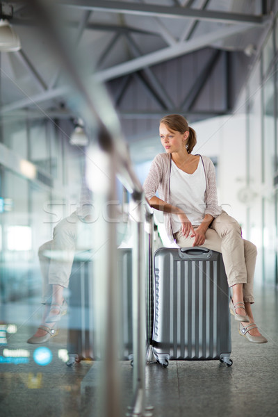 Young female passenger at the airport, about to check-in Stock photo © lightpoet