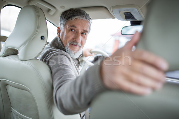 Senior drive driving his modern car, going in reverse Stock photo © lightpoet