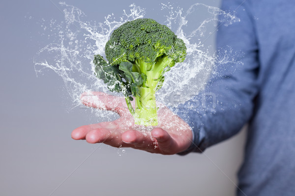 Man Hand Broccoli Water Splashes Stock photo © limbi007