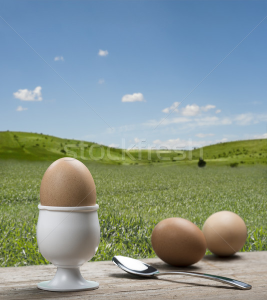 Eieren eierdopje theelepeltje houten tafel voedsel Stockfoto © limpido