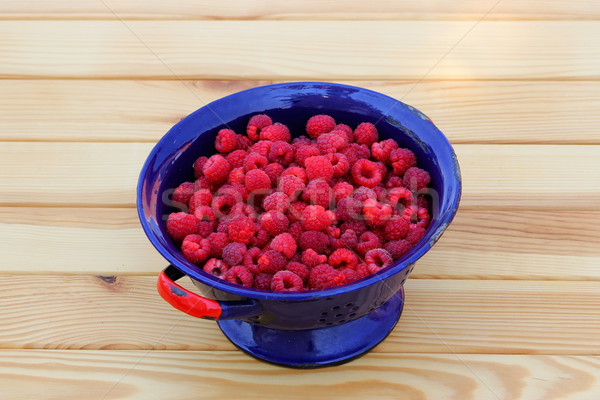 Raspberries in colander Stock photo © Lio22