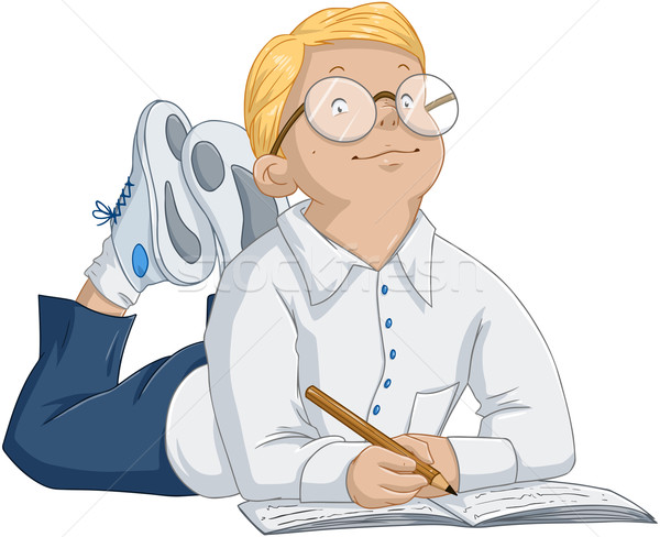 Stock photo: Smart Boy With Glasses Laying And Writing In Notebook