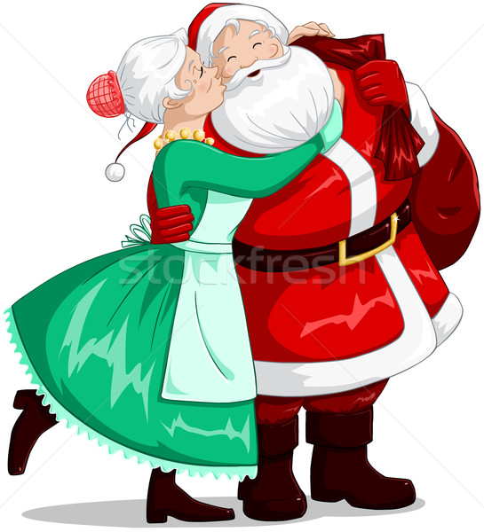 Mrs Claus Kisses Santa On Cheek And Hugs Stock photo © LironPeer