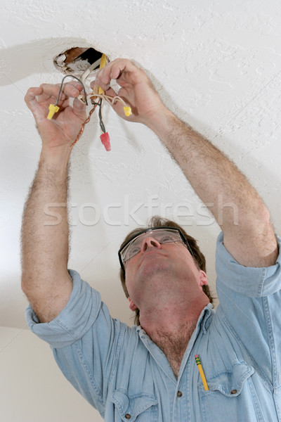 Electrician Pulling Wire Stock photo © lisafx