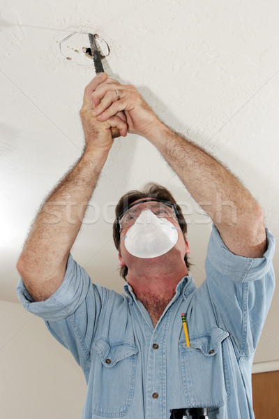 Sawing Hole In Plaster Stock photo © lisafx