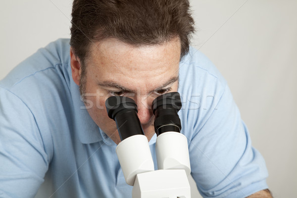 Looking Through Microscope Stock photo © lisafx
