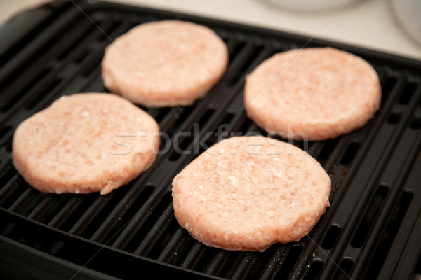 Raw Turkey Burgers on Grill Stock photo © lisafx