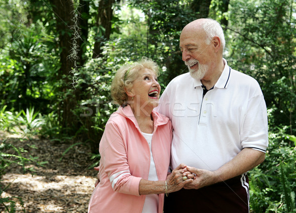 Actif couple de personnes âgées espace de copie heureux rire ensemble [[stock_photo]] © lisafx