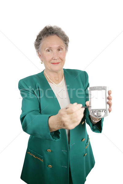 Wiadomość pda starszy kobieta interesu kamery Zdjęcia stock © lisafx