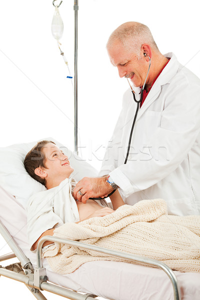 Friendly Pediatrician Examines Patient Stock photo © lisafx