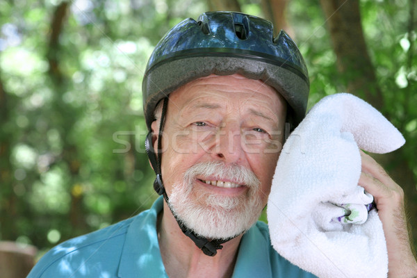 Suado senior homem bicicleta saúde Foto stock © lisafx