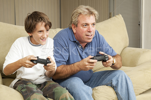 Hombre nino jugar videojuegos hijo de padre tío Foto stock © lisafx