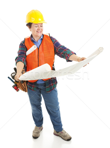 Female Worker Reviews Blueprints Stock photo © lisafx