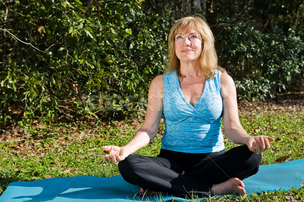 Stock photo: Mature Woman Yoga with Copyspace