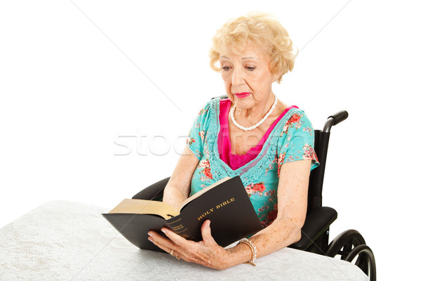Disabled Senior Woman Reads Bible Stock photo © lisafx
