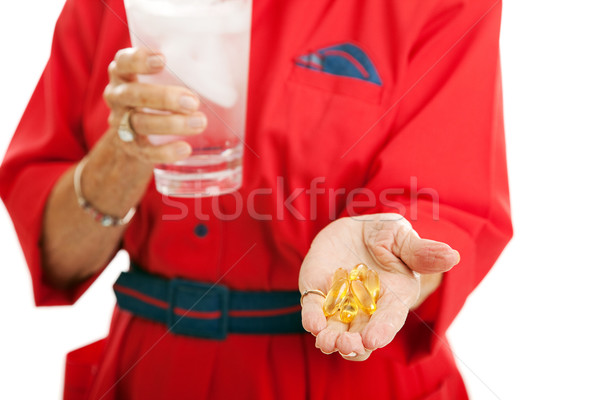 Mujer toma omega 3 altos cápsulas Foto stock © lisafx