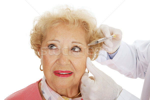 Kozmetik enjeksiyon gözler kıdemli kadın kozmetik cerrahi Stok fotoğraf © lisafx