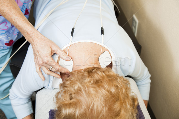 Elektomos biztatás terápia beteg hátfájás fitnessz Stock fotó © lisafx