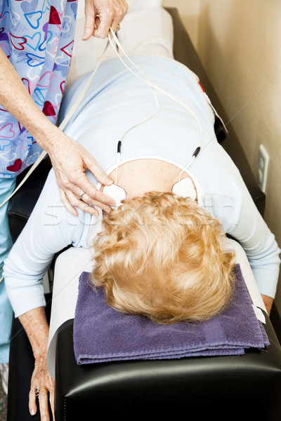 Fizioterápia elektomos biztatás terapeuta hát izomfájdalom Stock fotó © lisafx