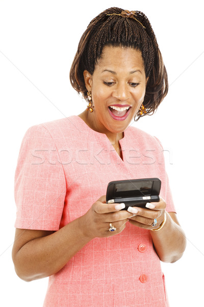 Businesswoman Reads Text Message Stock photo © lisafx