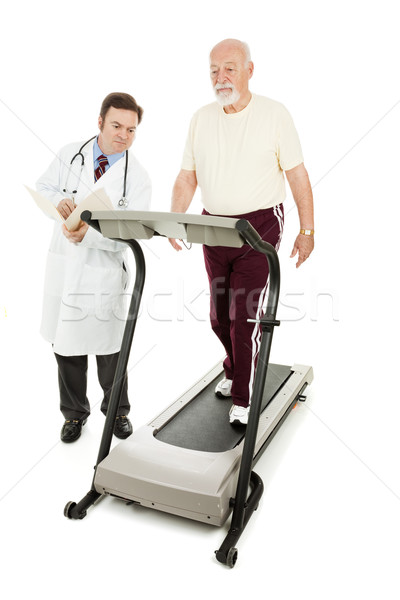 Stock photo: Doctor Monitors Senior on Treadmill
