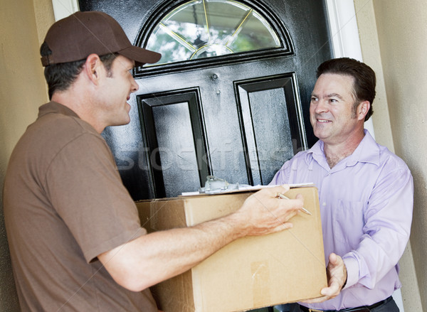 Man Receives Package Delivery Stock photo © lisafx