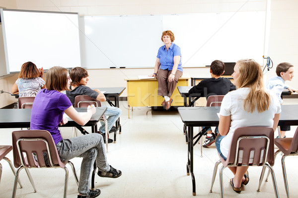 Foto d'archivio: Insegnante · classe · seduta · desk · insegnamento · adolescente