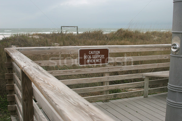 Resbaladizo mojado signo playa tormenta Foto stock © lisafx