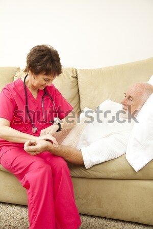Home Nurse Takes Blood Pressure Stock photo © lisafx